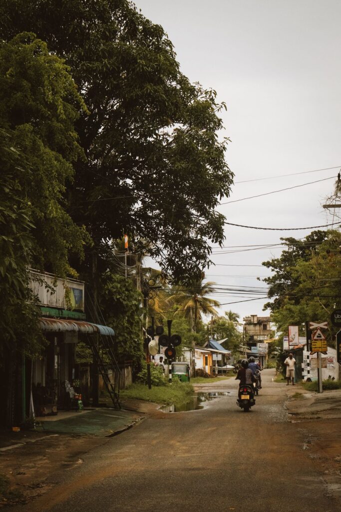 A quiet Sri Lankan village street lined with shops