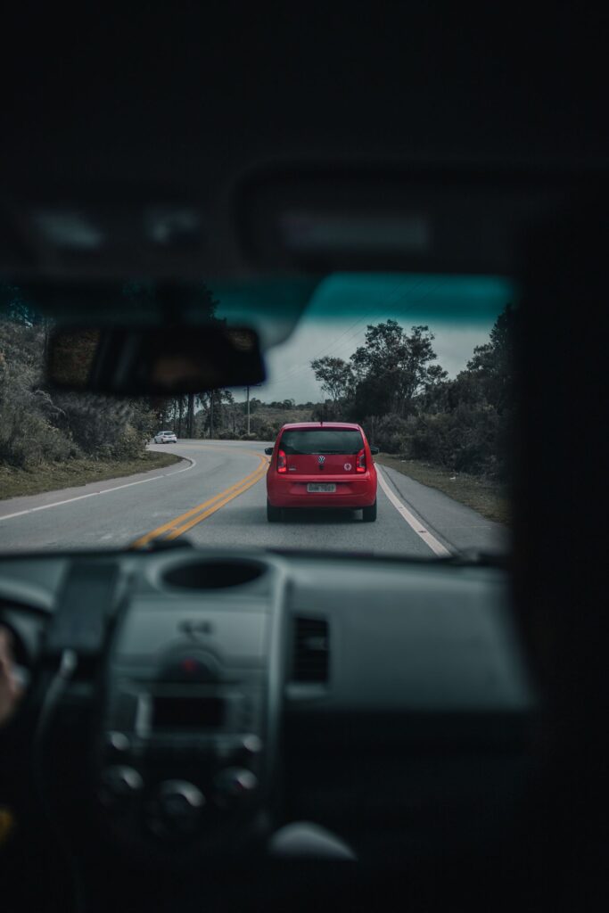 View through a windscreen of a car travelling along an open road